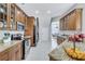 Spacious kitchen featuring granite countertops and wood cabinets at 805 Woodcarver Ln, Brandon, FL 33510