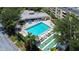 Aerial view showing condo community pool, shuffleboard, and building at 2616 Cove Cay Dr # 506, Clearwater, FL 33760