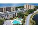 Aerial view of condo building, pool, and bay at 2616 Cove Cay Dr # 506, Clearwater, FL 33760