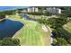 Aerial view showing condo buildings near golf course at 2616 Cove Cay Dr # 506, Clearwater, FL 33760