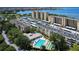Aerial view of condo community with pool, shuffleboard, and building at 2616 Cove Cay Dr # 506, Clearwater, FL 33760