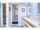 Clean bathroom with double vanity, shower, and plenty of storage at 2616 Cove Cay Dr # 506, Clearwater, FL 33760