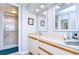 Bathroom features a double vanity, shower, and updated finishes at 2616 Cove Cay Dr # 506, Clearwater, FL 33760