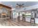 Common area with stone fireplace and kitchen at 2616 Cove Cay Dr # 506, Clearwater, FL 33760