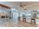 Community room features a stone fireplace, kitchen, and bar with granite countertops at 2616 Cove Cay Dr # 506, Clearwater, FL 33760