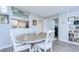 Elegant dining room, featuring built-in shelving and hardwood floors at 2616 Cove Cay Dr # 506, Clearwater, FL 33760