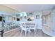 Condo dining area with round table and mirrored wall at 2616 Cove Cay Dr # 506, Clearwater, FL 33760