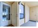Condo entry with private door, window, and access to hallway at 2616 Cove Cay Dr # 506, Clearwater, FL 33760