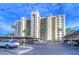 Exterior view of Cove Cay building with parking at 2616 Cove Cay Dr # 506, Clearwater, FL 33760