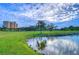 Peaceful golf course scene with water feature and building in background at 2616 Cove Cay Dr # 506, Clearwater, FL 33760