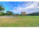 Golf course sand trap with lush green grass and building in background at 2616 Cove Cay Dr # 506, Clearwater, FL 33760