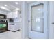 Condo kitchen with white cabinets and black appliances at 2616 Cove Cay Dr # 506, Clearwater, FL 33760
