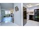 Modern kitchen features black appliances and white cabinetry at 2616 Cove Cay Dr # 506, Clearwater, FL 33760