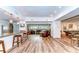 Open concept kitchen and living area with granite counters and hardwood floors at 2616 Cove Cay Dr # 506, Clearwater, FL 33760