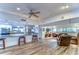 Open concept kitchen and living area with granite counters and hardwood floors at 2616 Cove Cay Dr # 506, Clearwater, FL 33760