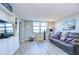 Relaxing living room featuring leather sofa and built-in shelving at 2616 Cove Cay Dr # 506, Clearwater, FL 33760