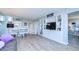 Open concept living room with built-in shelving and hardwood floors at 2616 Cove Cay Dr # 506, Clearwater, FL 33760