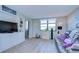 Relaxing living room with gray couch and built-in entertainment center at 2616 Cove Cay Dr # 506, Clearwater, FL 33760