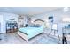 Bright bedroom with teal bedding and a workspace at 2616 Cove Cay Dr # 506, Clearwater, FL 33760