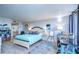 Main bedroom with light teal bedding and built-in shelving at 2616 Cove Cay Dr # 506, Clearwater, FL 33760