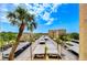 Covered parking lot with numerous parking spots and landscaping at 2616 Cove Cay Dr # 506, Clearwater, FL 33760