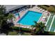 Community pool with hot tub, lounge chairs, and shuffleboard at 2616 Cove Cay Dr # 506, Clearwater, FL 33760