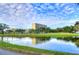 Tranquil waterfront view with reflection of building in water at 2616 Cove Cay Dr # 506, Clearwater, FL 33760