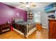 Spacious bedroom with wood floors, neutral walls, and plenty of natural light at 21631 Cormorant Cove Dr, Land O Lakes, FL 34637