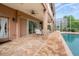 Spacious patio with dining area adjacent to the pool at 21631 Cormorant Cove Dr, Land O Lakes, FL 34637