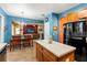 Open kitchen with island, breakfast area and view to Gathering room at 21631 Cormorant Cove Dr, Land O Lakes, FL 34637