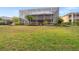 Spacious backyard with screened pool and lush landscaping at 21631 Cormorant Cove Dr, Land O Lakes, FL 34637