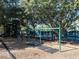 Playground with swings and play structures at 21631 Cormorant Cove Dr, Land O Lakes, FL 34637