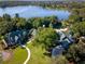 Aerial view of community amenities including lake and clubhouse at 21631 Cormorant Cove Dr, Land O Lakes, FL 34637