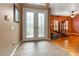 Bright and spacious entryway with double doors and hardwood floors at 21631 Cormorant Cove Dr, Land O Lakes, FL 34637