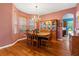 Elegant dining room featuring hardwood floors and a chandelier at 21631 Cormorant Cove Dr, Land O Lakes, FL 34637