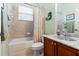 Bathroom with shower, tub, and double vanity at 21631 Cormorant Cove Dr, Land O Lakes, FL 34637