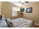 Bedroom with a queen-size bed and wood floors at 21631 Cormorant Cove Dr, Land O Lakes, FL 34637