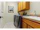 Laundry room with washer, dryer, cabinets, and sink at 21631 Cormorant Cove Dr, Land O Lakes, FL 34637