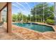 Relaxing screened pool with brick pavers and lush landscaping at 21631 Cormorant Cove Dr, Land O Lakes, FL 34637