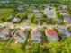 Aerial view of houses with pools in a residential community at 21631 Cormorant Cove Dr, Land O Lakes, FL 34637