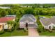 Two-story house situated on a large lot with mature trees at 21631 Cormorant Cove Dr, Land O Lakes, FL 34637