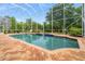 Inviting screened pool with a spa and ample deck space at 21631 Cormorant Cove Dr, Land O Lakes, FL 34637
