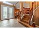 Elegant entryway with double doors and a staircase at 21631 Cormorant Cove Dr, Land O Lakes, FL 34637