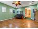 Bonus room with built-in shelving, comfortable seating, and access to upper hallway at 21631 Cormorant Cove Dr, Land O Lakes, FL 34637