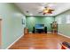 Versatile bonus room with wood floors and a ceiling fan, perfect for various uses at 21631 Cormorant Cove Dr, Land O Lakes, FL 34637