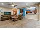 Open living room with view to kitchen and aquarium at 21631 Cormorant Cove Dr, Land O Lakes, FL 34637