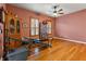 Home gym with exercise equipment and hardwood flooring at 21631 Cormorant Cove Dr, Land O Lakes, FL 34637
