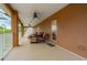Relaxing balcony with wicker furniture and stunning backyard views at 21631 Cormorant Cove Dr, Land O Lakes, FL 34637