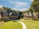 Two-building community center with a landscaped courtyard at 21631 Cormorant Cove Dr, Land O Lakes, FL 34637