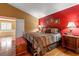 Main bedroom with king-size bed and ensuite bathroom at 21631 Cormorant Cove Dr, Land O Lakes, FL 34637